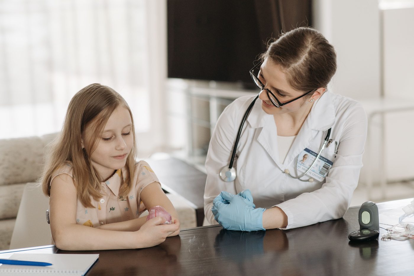 A doctor listening attentively to a patient and family member