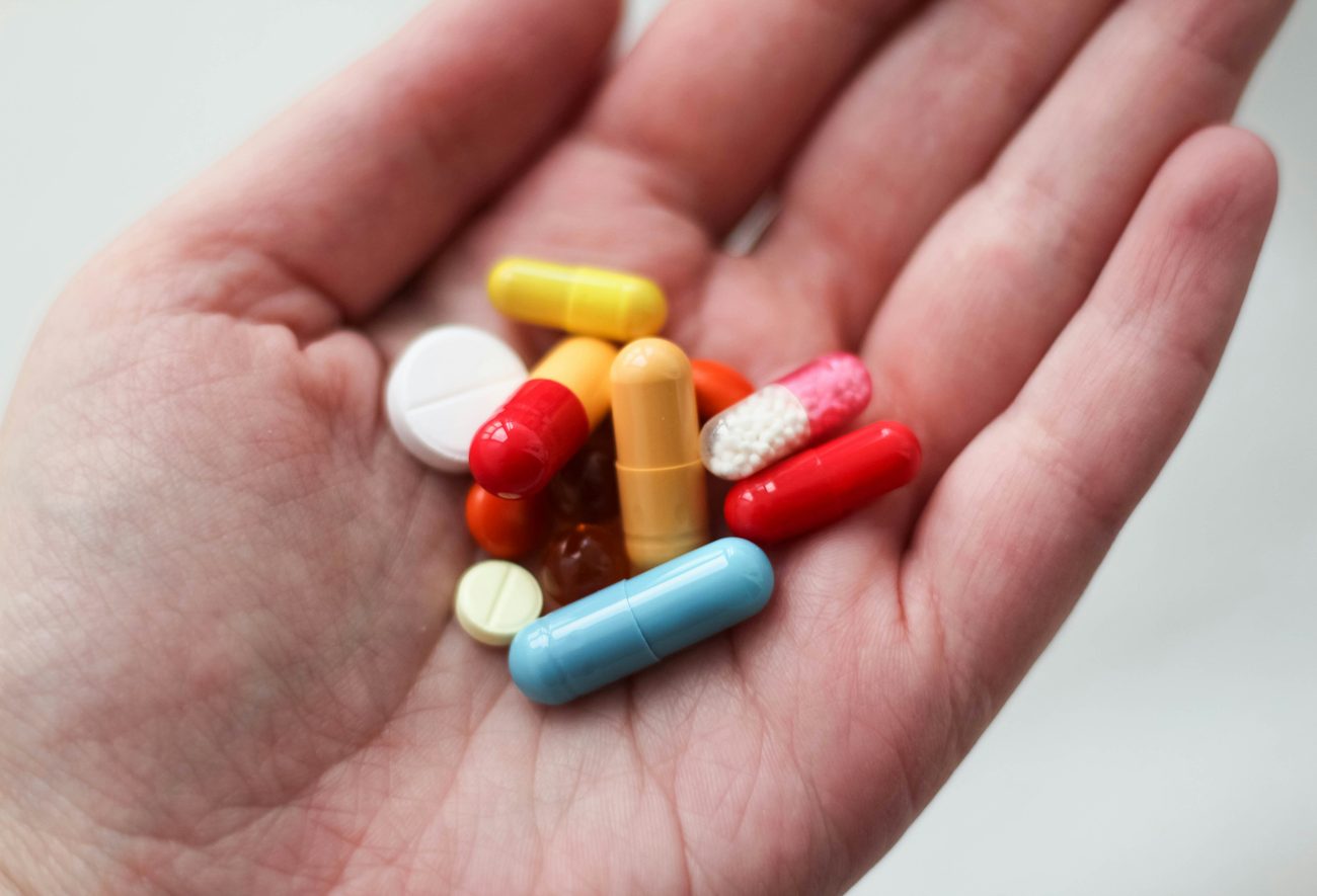 Pharmacist holding clearly organized medication